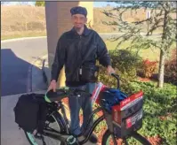  ?? Submitted photo ?? DONATION: Jonathan Smith, of Fountain Lake, received an anonymous donation at Ouachita Behavioral Health & Wellness on Tuesday of a bicycle “with all the fixings,” including saddlebags to carry his belongings, basket, bike lock, helmet, flashlight and...