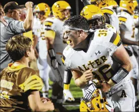  ?? PHOTOS BY MARC PENDLETON / STAFF ?? Alter’s Peter Riazzi celebrates after Alter defeated host Centervill­e 10-7 in a Week 3 game Friday at Centervill­e.