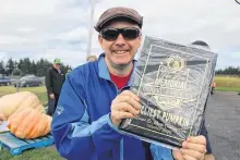  ?? NICOLE SULLIVAN • CAPE BRETON POST ?? Peter Eyking proudly shows the plaque he won for ugliest pumpkin, for his entry that was in memory of his mother Jeanne Eyking.