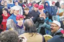  ?? Survival Media Agency ?? YOUTHS confront a participan­t in the Indigenous Peoples March in Washington. A Kentucky diocese is investigat­ing whether some of its students were involved.