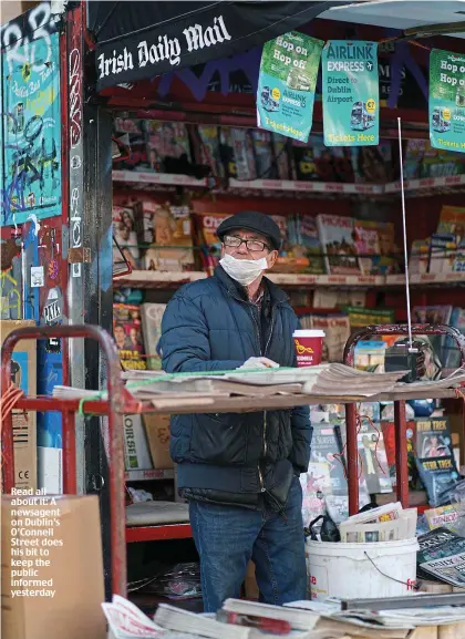  ??  ?? Read all about it: A newsagent on Dublin’s O’Connell Street does his bit to keep the public informed yesterday