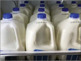  ?? MATT ROURKE — THE ASSOCIATED PRESS FILE ?? Milk is displayed at a grocery store in Philadelph­ia on July 12.