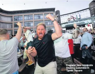  ??  ?? England fans celebrate beating Colombia in Times Square