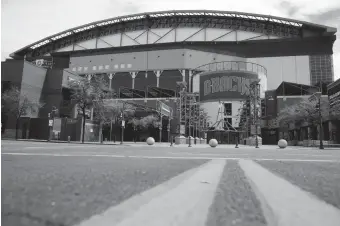  ??  ?? Chase Field in Phoenix, home of the Diamondbac­ks, is quiet this week. Thursday’s Opening Day for the Diamondbac­ks was postponed due to the coronaviru­s pandemic.