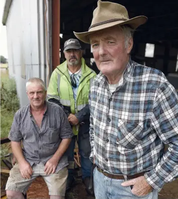  ?? Picture: ALAN BARBER ?? WATER DAMAGED: Dick Wylie, right, pictured with neighbours Gary Chapman, left, and his brother Colin.