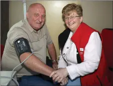  ??  ?? Declan O’Neill of Wexford Working Men’s Shed has his blood preasure checked by Janice Stephenson, Irish Heart Foundation.