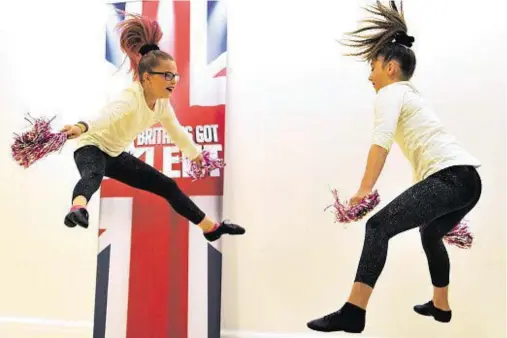  ?? Photograph­s: Gordon Lennox ?? JUMP: Amy Mackenzie and Morgan Petrie, both 11, from Forres, devised a new cheerleadi­ng routine.