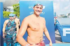  ?? — AFP file photo ?? Schooling gestures as he participat­es in the 2km swim segment during the Profession­al Triathlete­s Organisati­on’s Asian Open at Marina Bay in Singapore.