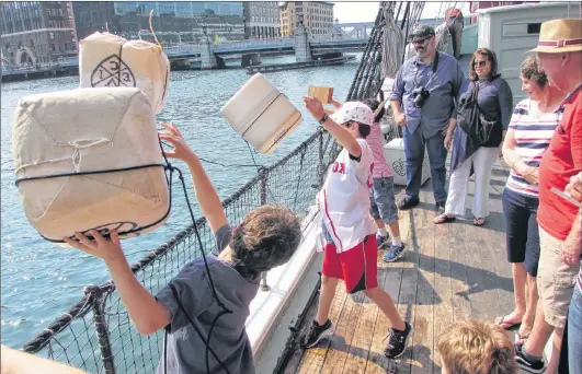  ?? JOHN NOWLAN PHOTO ?? Tossing Tea Overboard into Boston Harbour