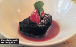  ??  ?? Chocolate cake in red berry juice