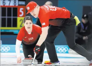  ?? Natacha Pisarenko ?? The Associated Press U.S. curling siblings Matt Hamilton sweeps and sister Becca directs during a mixed doubles match against Olympic Athletes from Russia on Thursday at the Winter Olympics in Gangneung, South Korea. Curling competitor­s are miked, and...