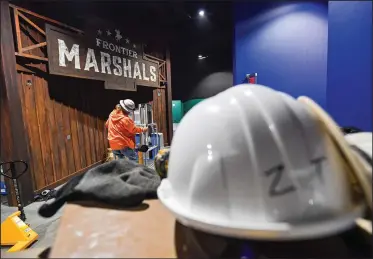  ?? (River Valley Democrat-Gazette/Hank Layton) ?? Workers construct exhibits Thursday at the U.S. Marshals Museum in downtown Fort Smith. Visit nwaonline.com/photo for today’s photo gallery.