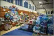  ?? ?? Donated supplies pile high inside the Peñasco evacuation center.