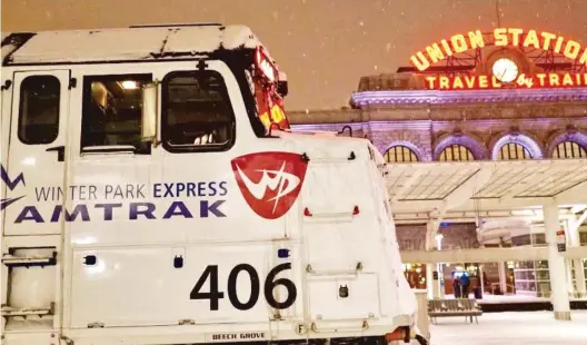  ?? | TREVOR HUGHES/ USA TODAY ?? The Winter Park Express ski train sits in Denver’s Union Station as snow falls.