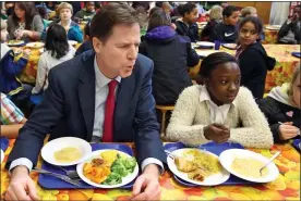  ??  ?? POLICY FLAW: Former Deputy PM Nick Clegg eating lunch with a school pupil