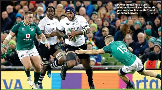  ??  ?? Power surge: Fiji’s giant winger Nemani Nadolo bursts past Andrew Porter (left) and Andrew Conway INPHO