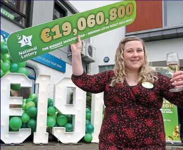  ?? ?? Retail bonus: Shop owner Laura Scriney celebrates winning Lotto ticket in Mayo