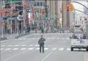  ?? REUTERS ?? A New York City Police officer at the Times Square in New York City on Tuesday.