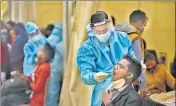  ?? BIPLOV BHUYAN/HT PHOTO ?? Travellers being screened for Covid-19 at Anand Vihar Inter State Bus Terminal in New Delhi on Sunday