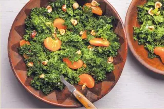  ??  ?? The combinatio­n of sweet, juicy citrus, massaged greens, honey and hazelnuts in this Kale, Clementine and Hazelnut Salad is a perfect foil for grilled meats.