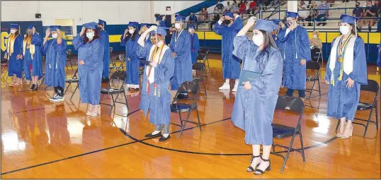  ?? (Westside Eagle Observer/Mike Eckels) ?? After the presentati­on of the diplomas, the Class of 2020 moves its tassels from left to right, indicating they are now graduates of Decatur High School.