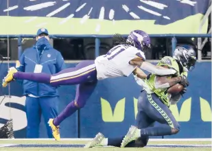  ?? JOHN FROSCHAUER/AP ?? Seahawks receiver DK Metcalf beats the Vikings’Anthony Harris for the winning TD catch with 15 seconds left Sunday night in Seattle.