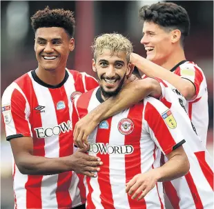  ??  ?? HAT-TRICK HERO Brentford’s Said Benrahma (centre) celebrates scoring his second goal