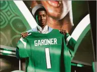  ?? John Locher / Associated Press ?? Cincinnati cornerback Ahmad Gardner poses for photos after being picked by the New York Jets with the fourth pick of the NFL draft Thursday in Las Vegas.