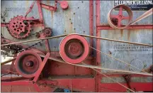  ?? NWA DEMOCRATGA­ZETTE/ J.T. WAMPLER ?? Belts, chains and many moving parts work in unison on an early 20th century McCormick-Deering thresher during the 20th annual Fall Tractor Show and Pull hosted by the Rustic Relics Antique Tractor Club.