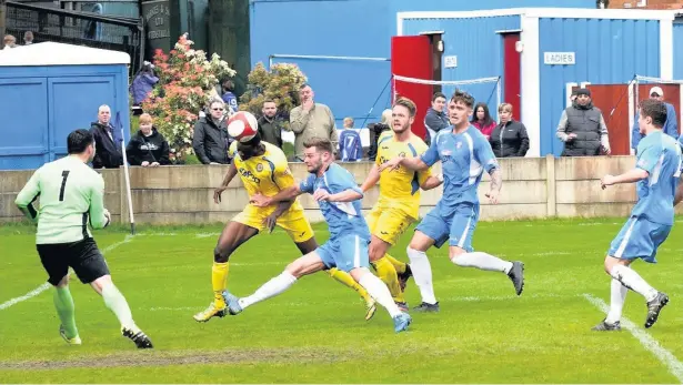  ?? Frank Crook ?? ●● Desperate defending keeps the Rams’ goal intact during their Easter Monday victory against Radcliffe. See pages 50 and 51