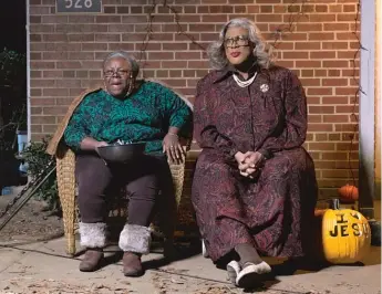  ??  ?? In “Boo! A Madea Halloween,” the outspoken grandma ( right, with Cassi Davis) is plagued by poltergeis­ts, ghosts, ghouls and zombies. “The audiences won’t let her go,” Perry says.
| LIONSGATE