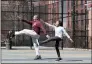  ?? KATHY WILLENS — THE ASSOCIATED PRESS FILE ?? Fred Frazer, a property manager, exercises with his daughter Olivia, 10, on the Christophe­r “Biggie” Wallace basketball courts March 26 in the Brooklyn borough of New York.