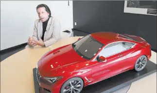 ?? SHIZUO KAMBAYASHI/ ASSOCIATED PRESS ?? Nissan’s design chief Alfonso Albaisa is shown with an Infiniti Prototype during an interview at the Nissan Technical Center in Atsugi, near Tokyo, on Feb. 27. Albaisa draws upon the cultures of Japan, the United States and Cuba in concocting car...