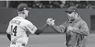  ?? [AP PHOTO/DAVID J. PHILLIP, FILE] ?? In this Oct. 13, 2018, photo, then-Astros manager AJ Hinch, left, and then-Red Sox manager Alex Cora shake hands before Game 1 of the ALCS in Boston.