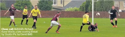  ??  ?? Close call Bellshill’s Richard Kane blocks a late scoring threat by Shotts (Pic by David Bell)