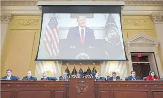  ?? Photo / AP ?? A video of then-President Donald Trump speaking is shown at a hearing of the House select committee.