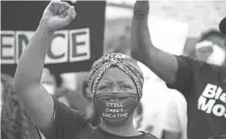  ?? DUSTIN CHAMBERS/GETTY IMAGES ?? Black protesters have taken to the streets in cities across the world in a call for equality and justice.