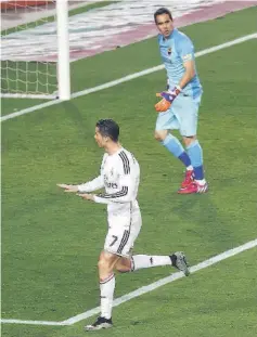  ??  ?? Real Madrid’s Portuguese forward Cristiano Ronaldo (left) celebrates after scoring beside Barcelona’s Chilean goalkeeper Claudio Bravo during the “clasico” Spanish league football match FC Barcelona vs Real Madrid CF at the Camp Nou stadium in...