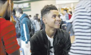  ?? Rachel Aston Las Vegas Review-Journal @rookie__rae ?? D’Andre Burnett, 17, talks to friends during lunch Oct. 19 at Shadow Ridge High School. Burnett has a 50-50 chance of graduating.