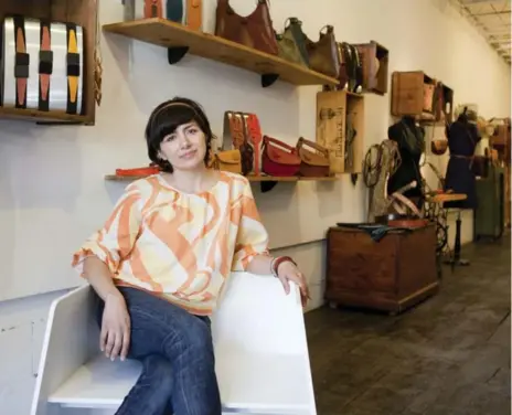  ?? MATTHEW SHERWOOD PHOTOS FOR THE TORONTO STAR ?? Susana Erazo co-owns Hide, a leather boutique on Dundas St. W., with her sister Sandra Erazo. She designs many of the shop’s leather goods.