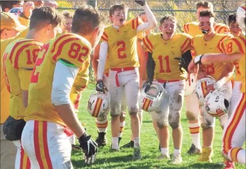  ?? Peter Wallace / For Hearst Connecticu­t Media ?? Gilbert/Northweste­rn players cheer their seniors in a traditiona­l post-game slide in the grass following the Yellowjack­ets’ win over Coventry/Windham Tech/Bolton/Lyman Memorial in 2019.