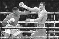  ?? AP/MATT DUNHAM ?? Anthony Joshua (left) knocked out Wladimir Klitschko with an uppercut in the 11th round Saturday in London.