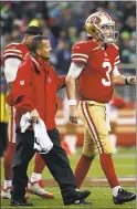  ??  ?? Mixed emotions: Left: Starting quarterbac­k C.J. Beathard (3) walks off the field after suffering a knee injury in the fourth quarter. Right, Jimmy Garoppolo (10) celebrates a last-minute touchdown against the Seahawks.