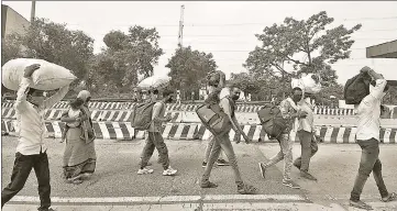  ?? SUNIL GHOSH/HTPHOTO ?? Stripped of their livelihood, India’s workers refused to be locked down. They wanted to make their way home. And when the State blocked transport, they walked. This was not an act of desperatio­n. It was an act of power