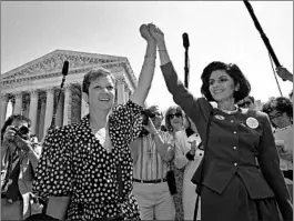  ?? J. SCOTT APPLEWHITE/AP ?? Norma McCorvey, left, aka Jane Roe in 1973’s Roe v. Wade, and attorney Gloria Allred hold hands at the U.S. Supreme Court in 1989 after listening to arguments in an abortion case.