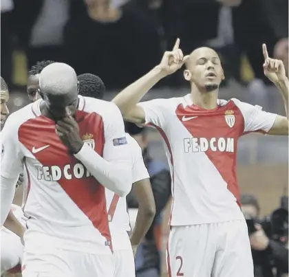  ??  ?? 2 Fabinho, right, celebrates Monaco’s second goalinthe French side’s 3-1 victory over Manchester City last night.