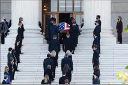  ?? MICHAEL BROCHSTEIN/SIPA USA ?? Former clerks of Justice Ruth Bader Ginsburg line up to pay their respects as her casket is brought into the Supreme Court building on Wednesday in Washington, D.C.