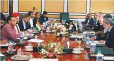  ?? AP ?? A delegation of Indian experts, headed by P.K. Saxena, (left), holds talks with their Pakistani counterpar­ts led by Mirza Asif Saeed (right) in Islamabad yesterday.