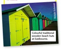  ??  ?? Colourful traditiona­l wooden beach huts at Eastbourne.