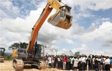  ?? - Picture: Innocent Makawa ?? Transport and Infrastruc­tural Developmen­t Minister Felix Mhona breaks the ground using the excavator for the reconstruc­tion of the 43km Shurugwi-Mandamabwe Road at Mufiri Business Centre yesterday.